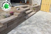 retaining-wall-with-steps-and-paver-path-Between-the-Edges-hardscape-design-Evans-GA